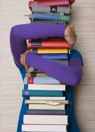 Woman with a Pile of Books --- Image by © Ursula Klawitter/zefa/Corbis